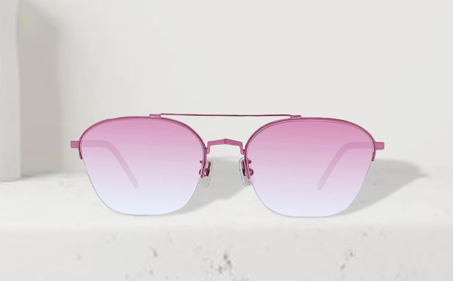 Givenchy GV Speed 57mm Pilot Sunglasses on a Table