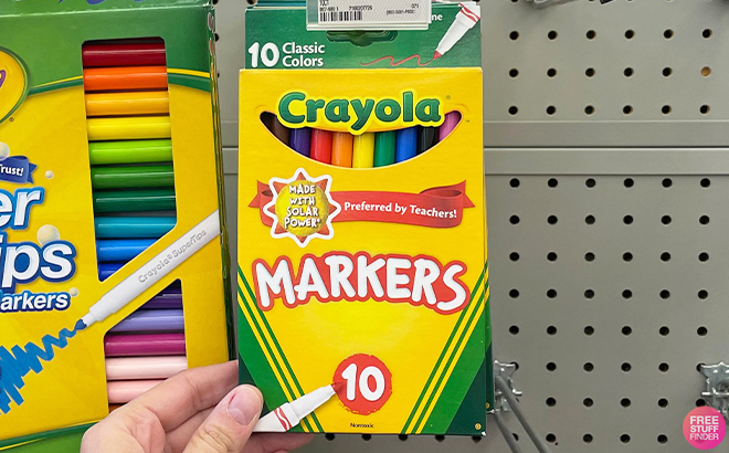 Hand Holding Crayola 10 Count Markers at Walgreens