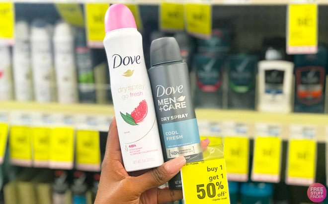 Hand Holding Dove Dry Spray and Dove Men Dry Spray at CVS Store in Front of a Shelf