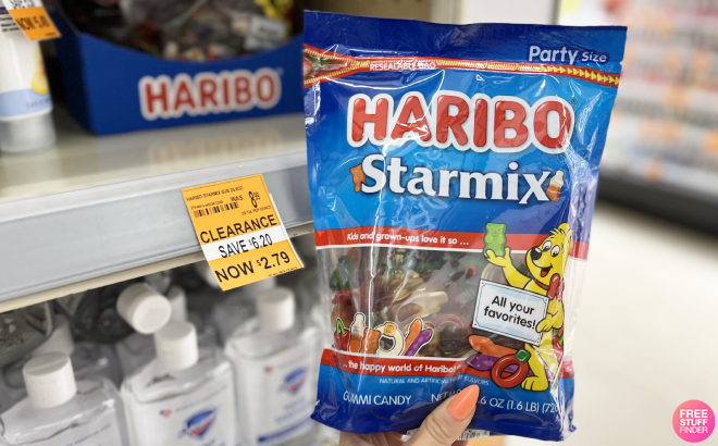 Hand Holding Haribo Starmix Gummies