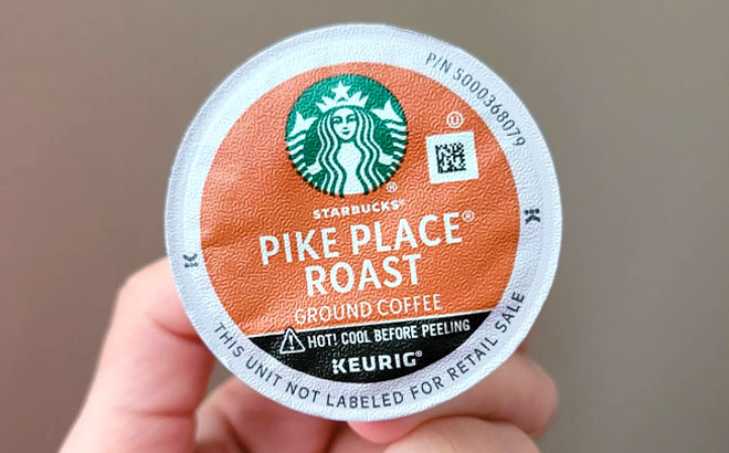 Hand Holding Starbucks K Cups Pike Place Roast