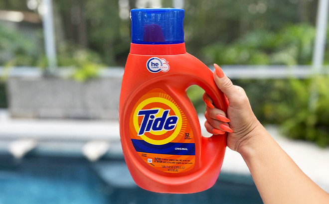 Hand Holding Tide Liquid Detergent