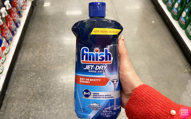 Hand Holding a Bottle of Finish Jet Dry Rinse Aid