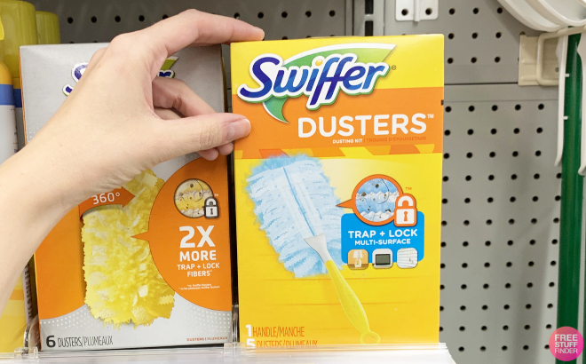 Hand Holding a Box of Swiffer Dusters 6 Piece Dusting Kit
