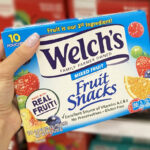 Hand Holding a Box of Welchs Fruit Snacks
