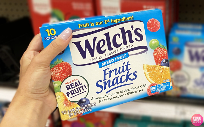 Hand Holding a Box of Welchs Fruit Snacks