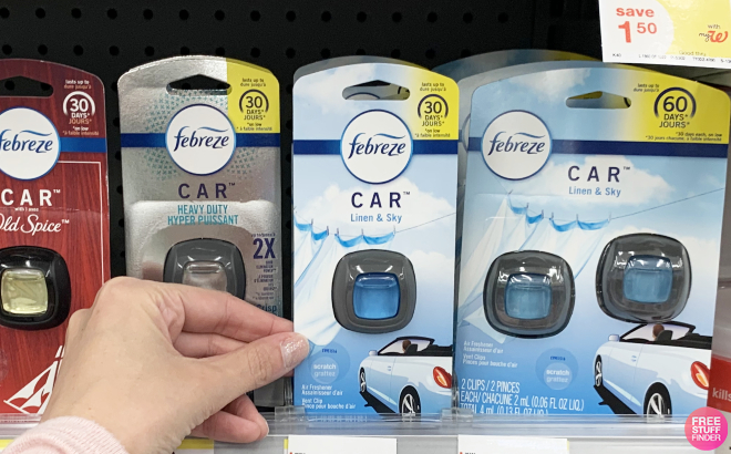 Hand Holding a Car Air Freshener Vent Clip