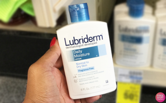 Hand Holding a Lubriderm Body Lotion
