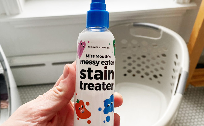 Hand Holding a Miss Mouths Messy Eater Stain Treater Spray
