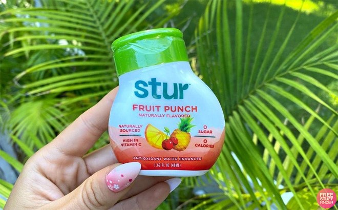 Hand Holding a Stur Fruit Punch Water Enhancer