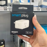 Hand Holding the Box of Amazon Smart Plug