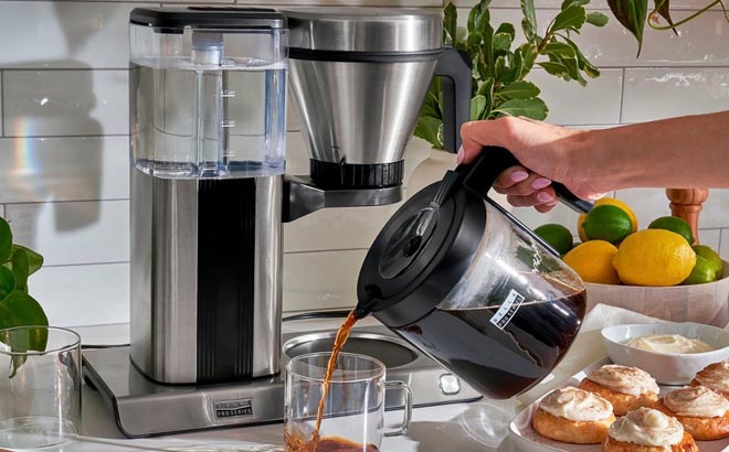 Hand Pouring a Cup with Coffee Using Bella Pro Series 8 Cup Pour Over Coffee Maker