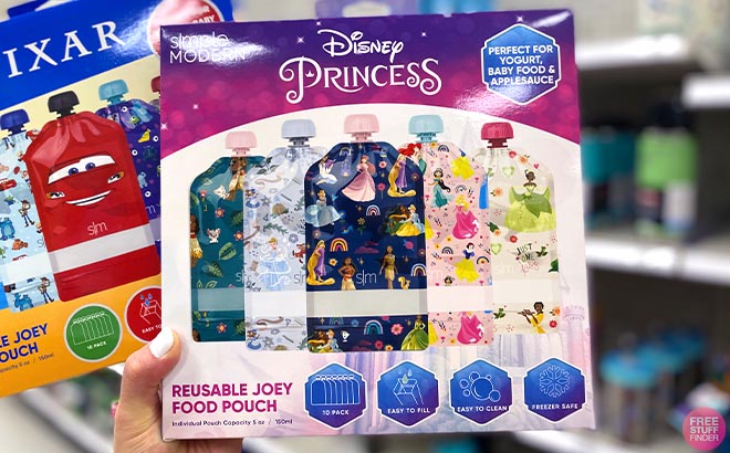 Hand holding Disney Kids Reusable Food Pouches Disney Princess