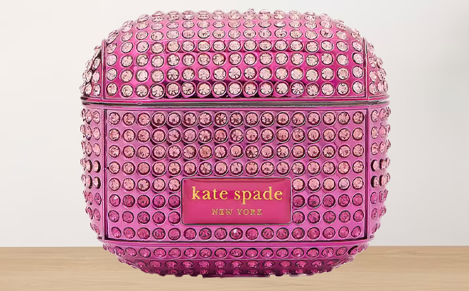 Kate Spade Rhinestone Embossed AirPods Case on a Table