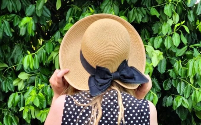 Lady Wearing a Lauren Conrad Straw Split Back Cloche Hat