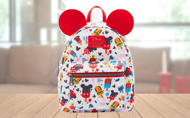 Loungefly Disney Mickey Mouse Friends Popsicle Mini Backpack on a Wooden Table