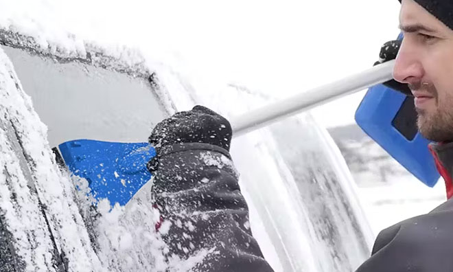 Man Using Snow Joe Telescoping Snow Broom with Lights