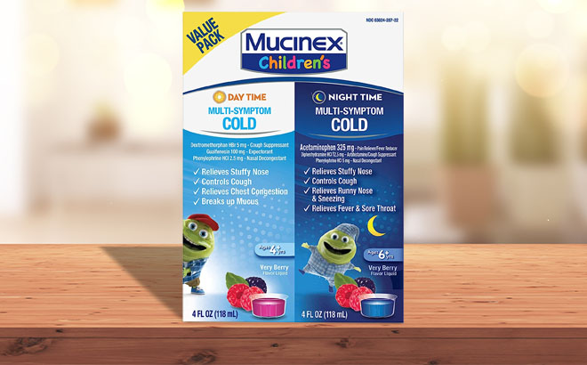 Mucinex Childrens Multi Symptom Day Night Cold Relief 2 Pack on a Table