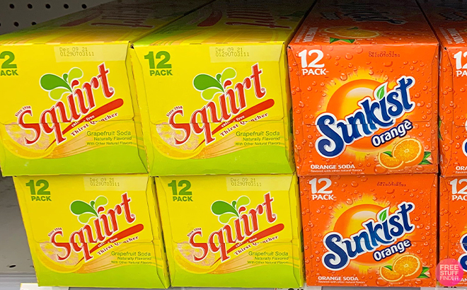 Multiple Squirt and Sunkist Soda Boxes on a Shelf
