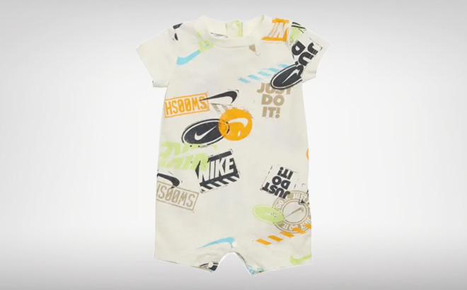 Nike Wild Air Allover Print Baby Romper on a Gray Background