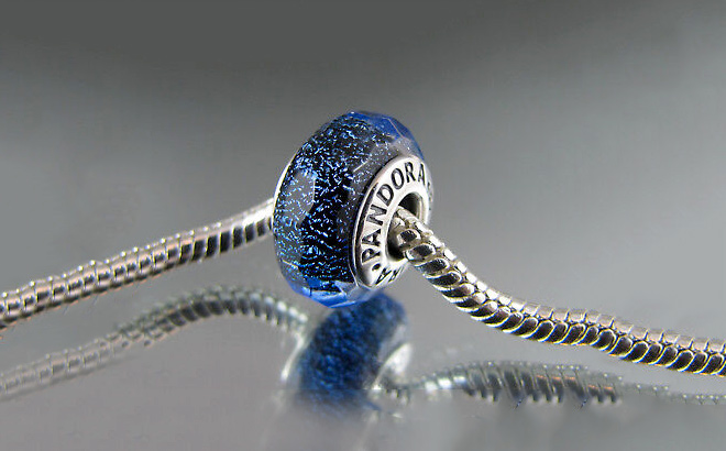 Pandora Faceted Blue Murano Glass Charm ona Glass Table