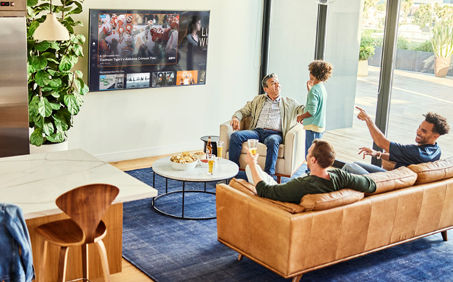 People in a Living Room Watching Sling TV