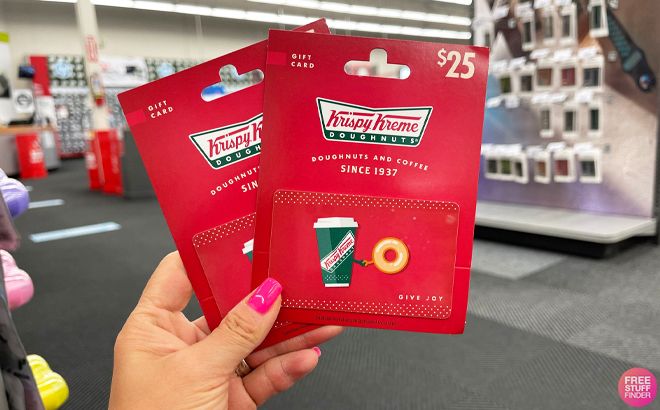Person Holding 2 Krispy Kreme Gift Cards