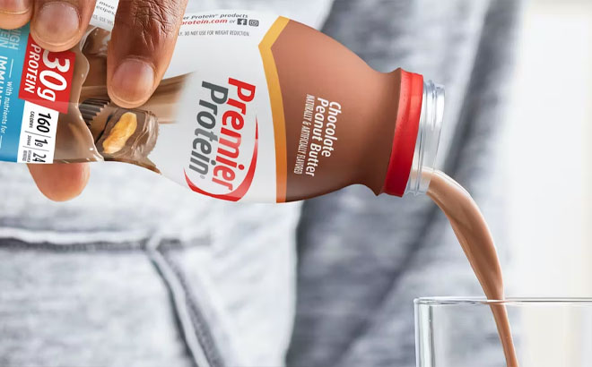Pouring Premier Protein Shake Chocolate Peanut Butter on a Glass