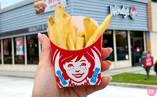 Wendys Fries with Wendys Restaurant as Background