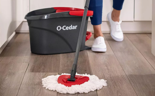 Woman Cleaning the Floor with O Cedar EasyWring Spin Mop and Bucket