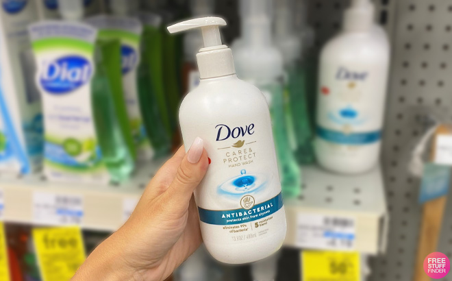 Woman Holding a Bottle of Dove Advanced Care and Protect Hand Soap