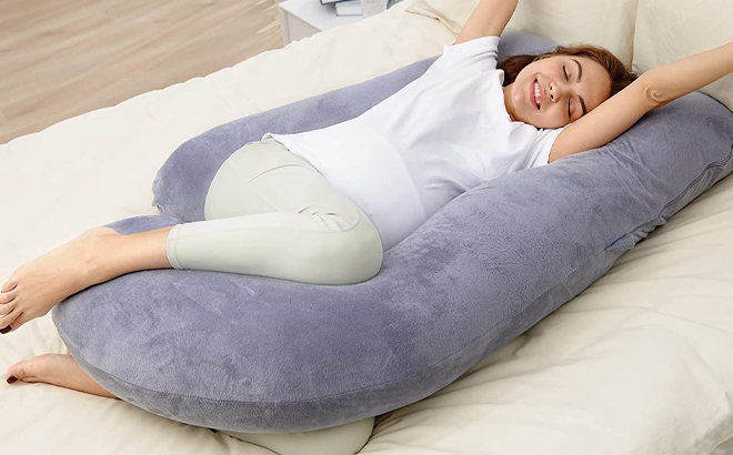 Woman Laying on a U Shaped Maternity Pillow