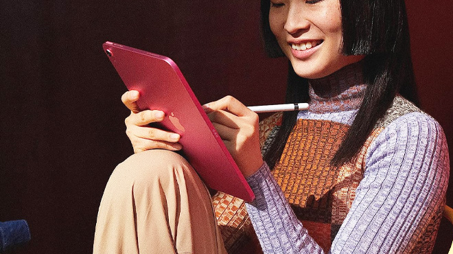 Woman using an Apple iPad 10th Generation
