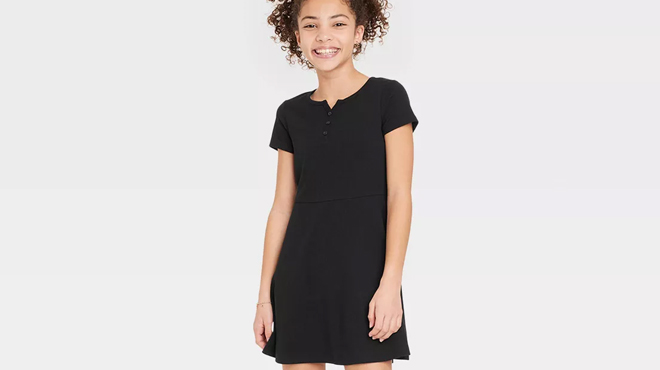 a Girl Wearing a Black Art Class Girls Henley Skater Knit Dress