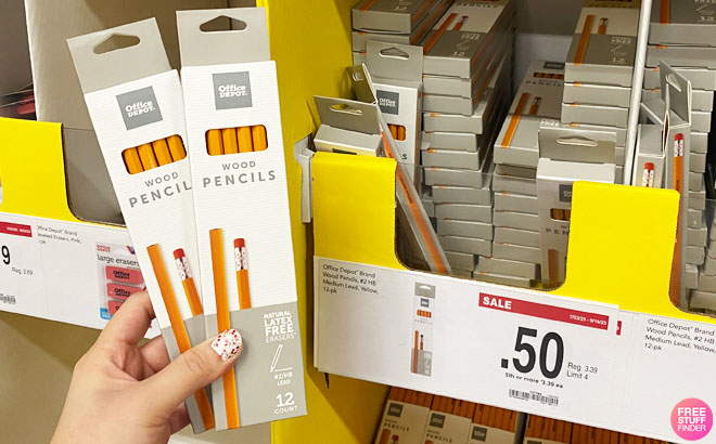 a Hand Holding Two Boxes of Office Depot Wood Pencils 12 Count