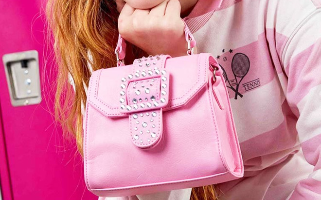 A Girl is Holding a Pink Rhinestone Accent Satchel