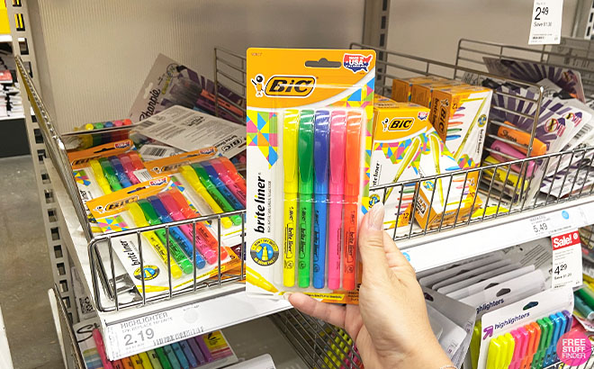 A Hand Holding BIC Highlighters