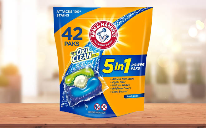 Arm Hammer 5 in 1 Laundry Detergent 42 Count Pods Fresh Scent on a Wooden Table
