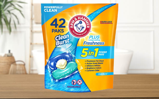 Arm Hammer Clean Burst 5 in 1 Laundry Detergent Power Paks on a Wooden Table