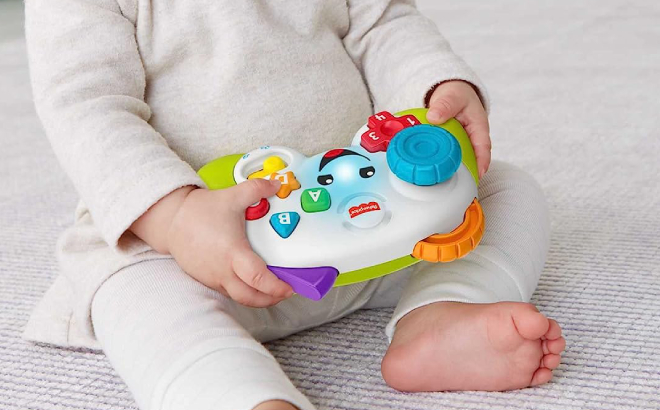 Baby Playing with Fisher Price Controller Pretend Video Game