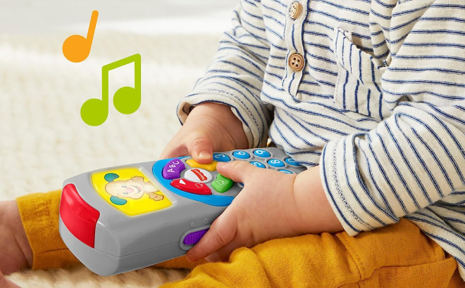 Baby Playing with Fisher Price Puppys Remote Pretend TV Control