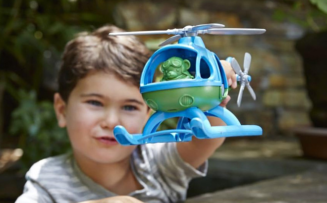 Boy is Holding Green Toys Helicopter