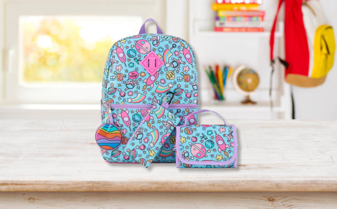 Cudlie 5 Piece Girls Space Backpack Set on the table