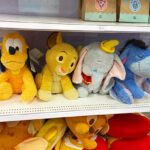Four Disney Weighted Plushies on a Shelf at Target