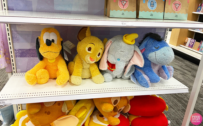 Four Disney Weighted Plushies on a Shelf at Target