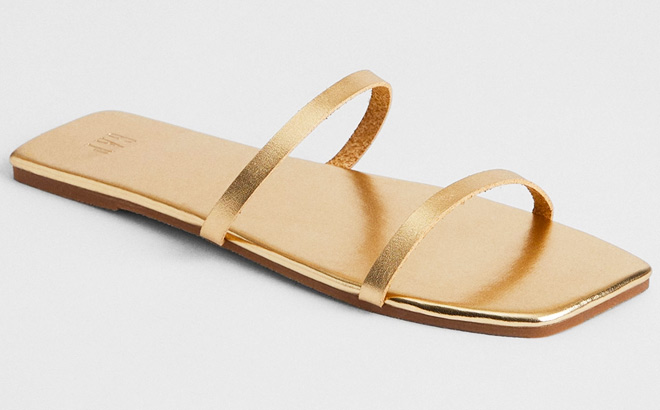 Gap Factory Metallic Faux Leather Sandals in gold color on the gray background