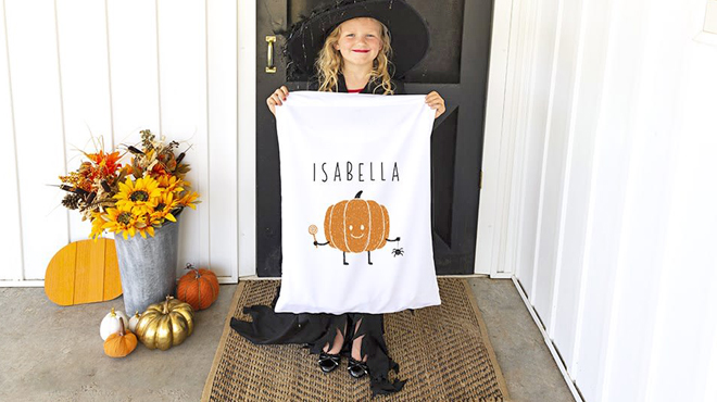 Girl Holding a Personalized Halloween Trick Or Treat Bag