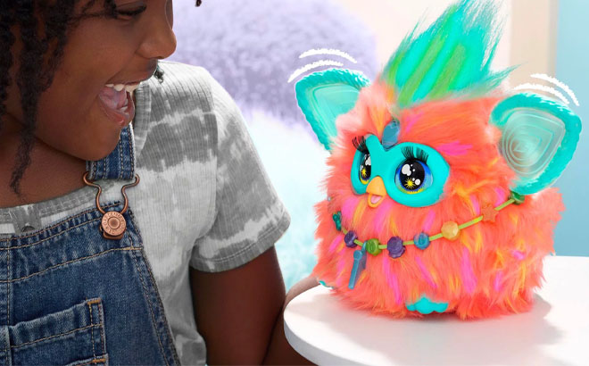 Girl Playing Furby Coral Plush Interactive Toy