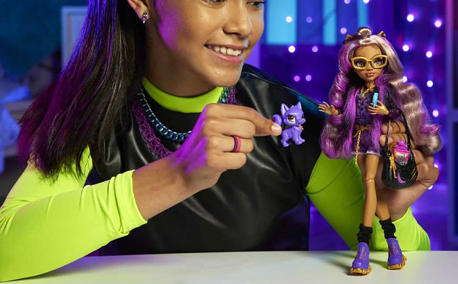 Girl Playing Monster High Fashion Doll