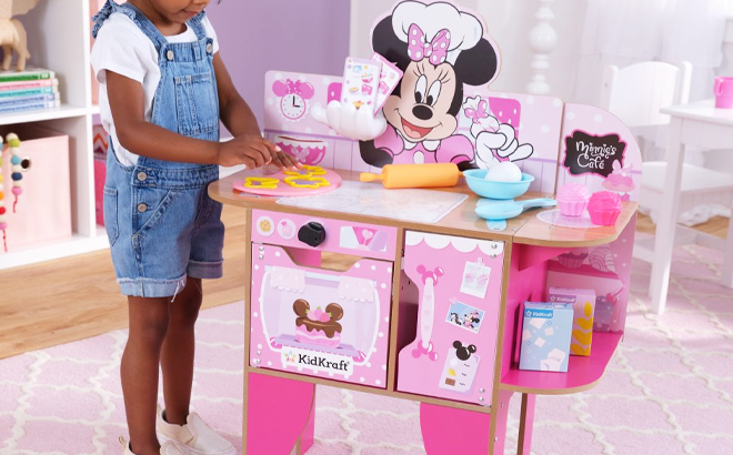 Girl Playing with KidKraft Minnie Mouse Bakery Cafe Play Set